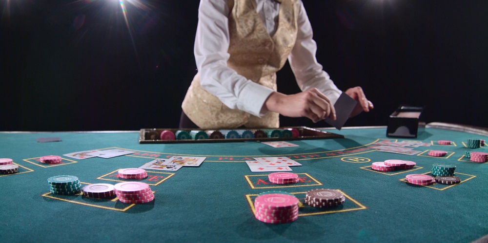 Live casino studio with dealer at gaming table
